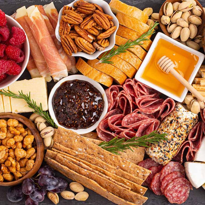 A cheese, chutney, charcuterie, fruit, biscuits and meat board