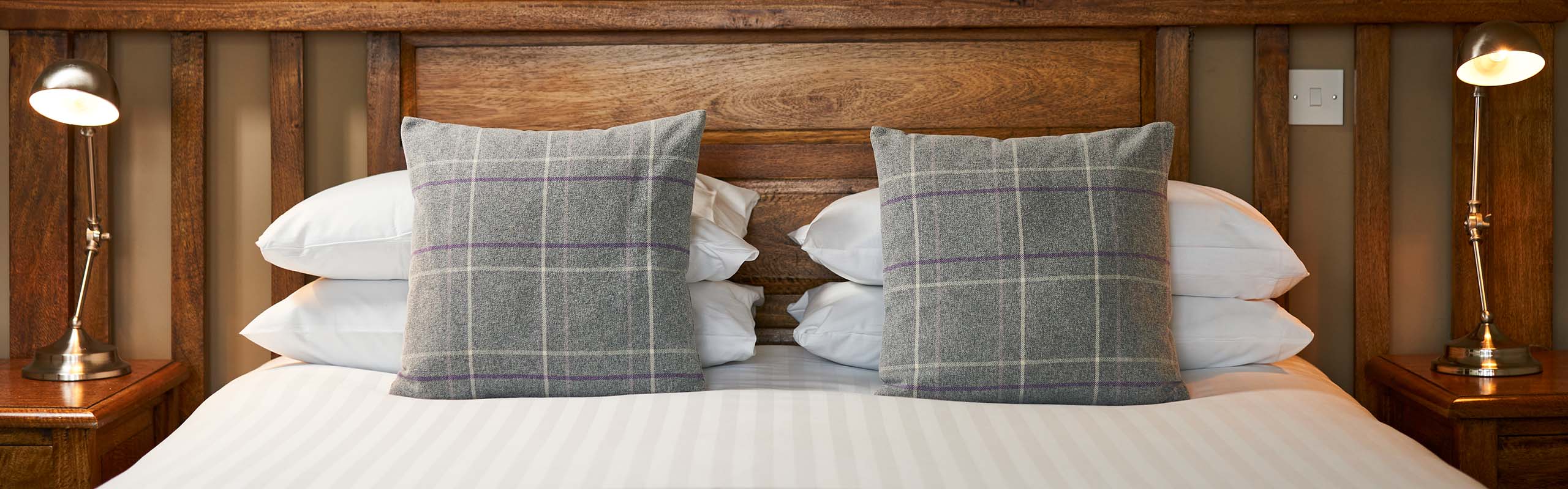 A double bed detail of its cushions in the Ulbster Arms Hotel in Caithness