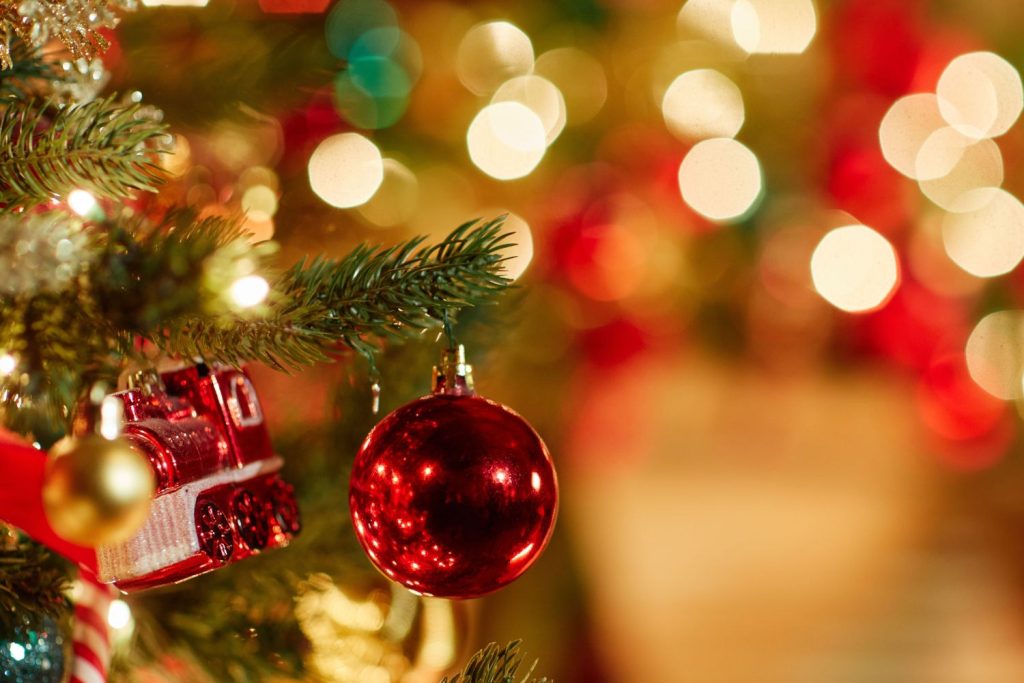 A close up of a Christmas tree with its lights and decorations