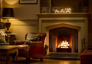 The cosy library with open fire at the Ulbster Arms Hotel