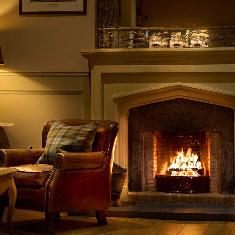 The cosy library with open fire at the Ulbster Arms Hotel