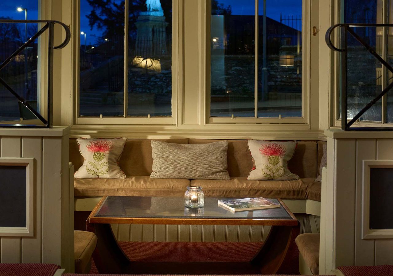 A cosy seating area in the library at the Ulbster Arms Hotel in Caithness