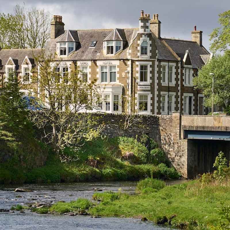 A view of the Ulbster Arms Hotel in Caithness from the river in front of it