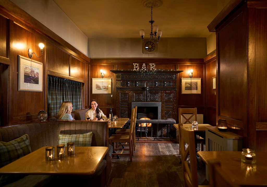 The Ulbster Arms Hotel in Caithness with two people enjoying a drink