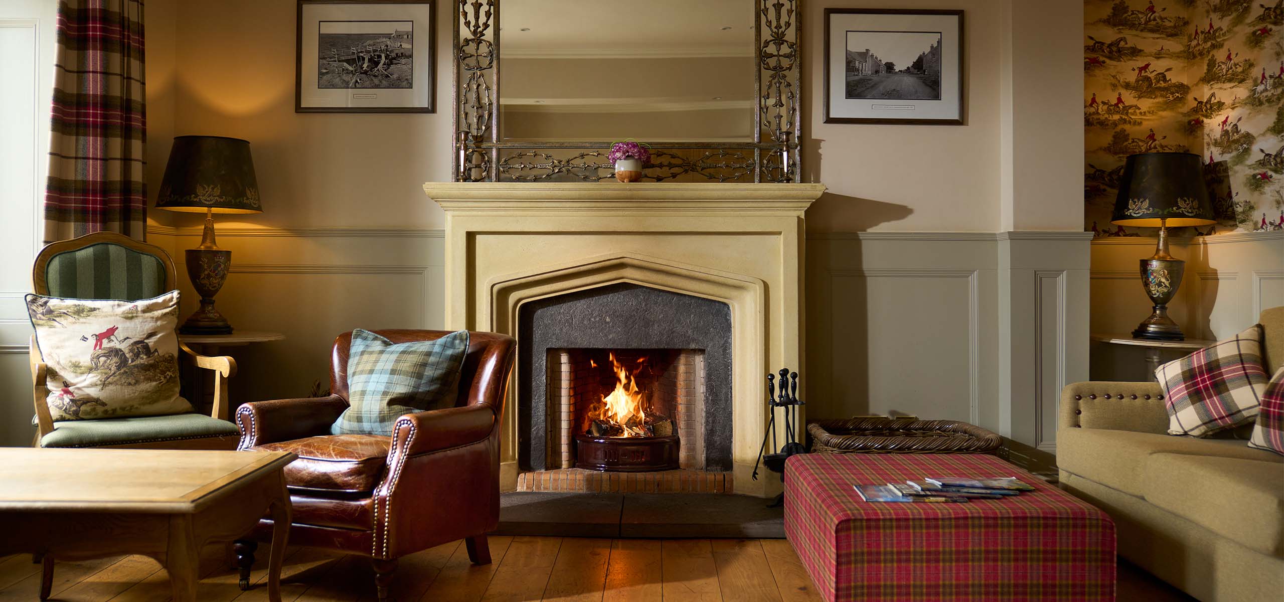 The library with a roaring fireplace at the Ulbster Arms Hotel in Caithness