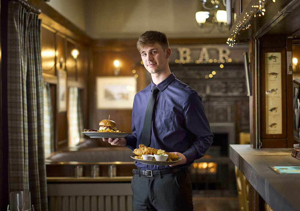 A waiter at the Ulbster Arms Hotel