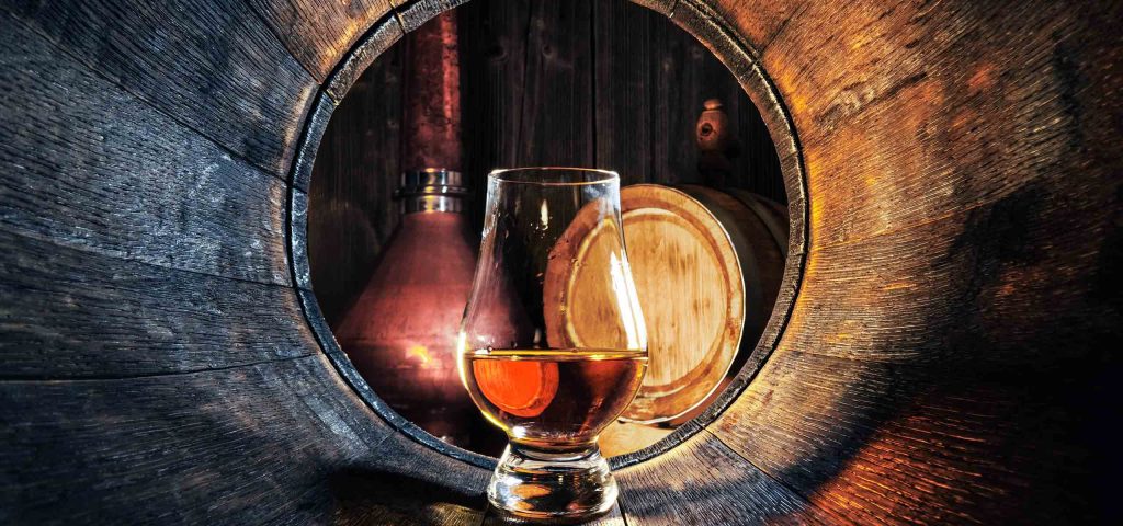 A dram of whisky in a whisky barrel