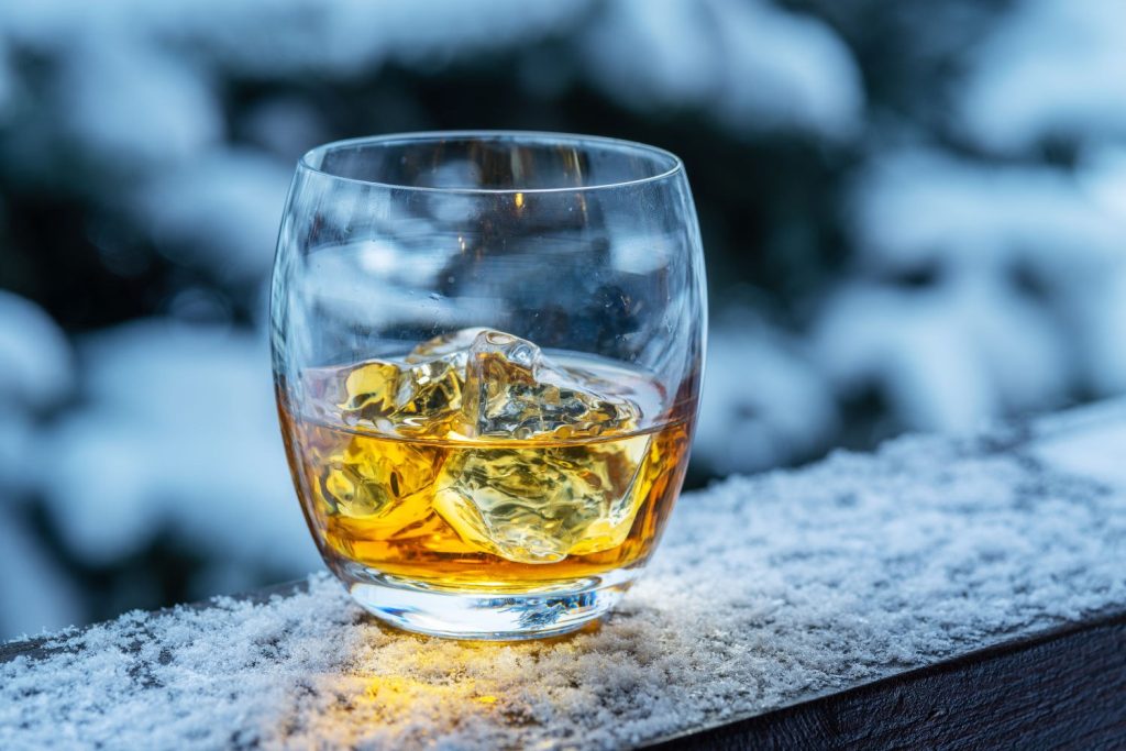 A dram of whisky on a frosty wall