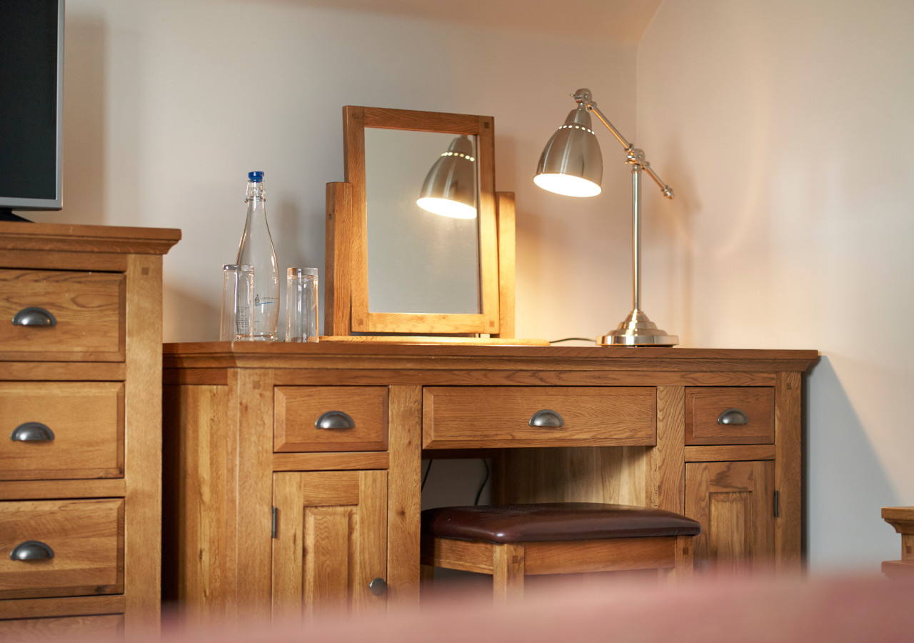 Desk and lamp in a hotel bedroom