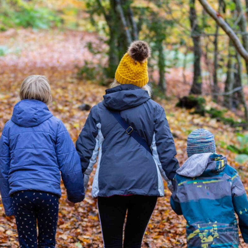 Mum and two children on an autumn walk