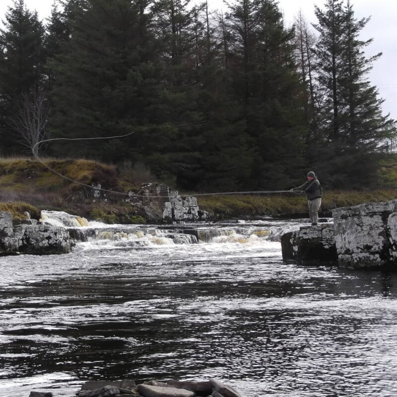 Man fishing on the River Thurso in Scotland