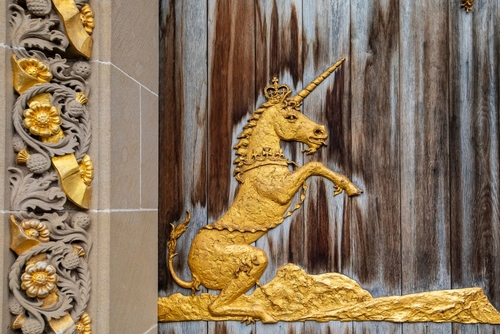 A golden unicorn on an old Scottish door.